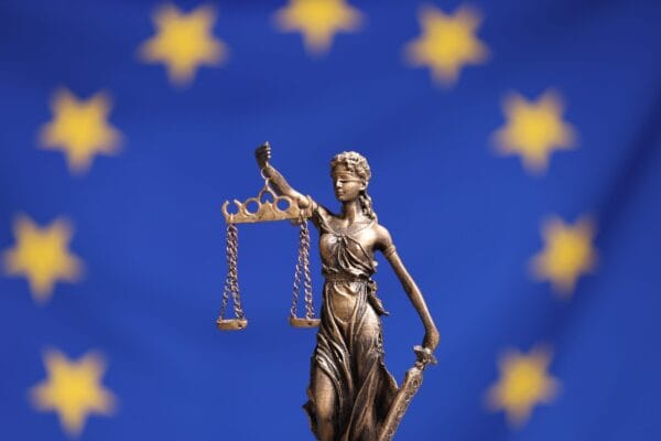 EU flag with figure of justice